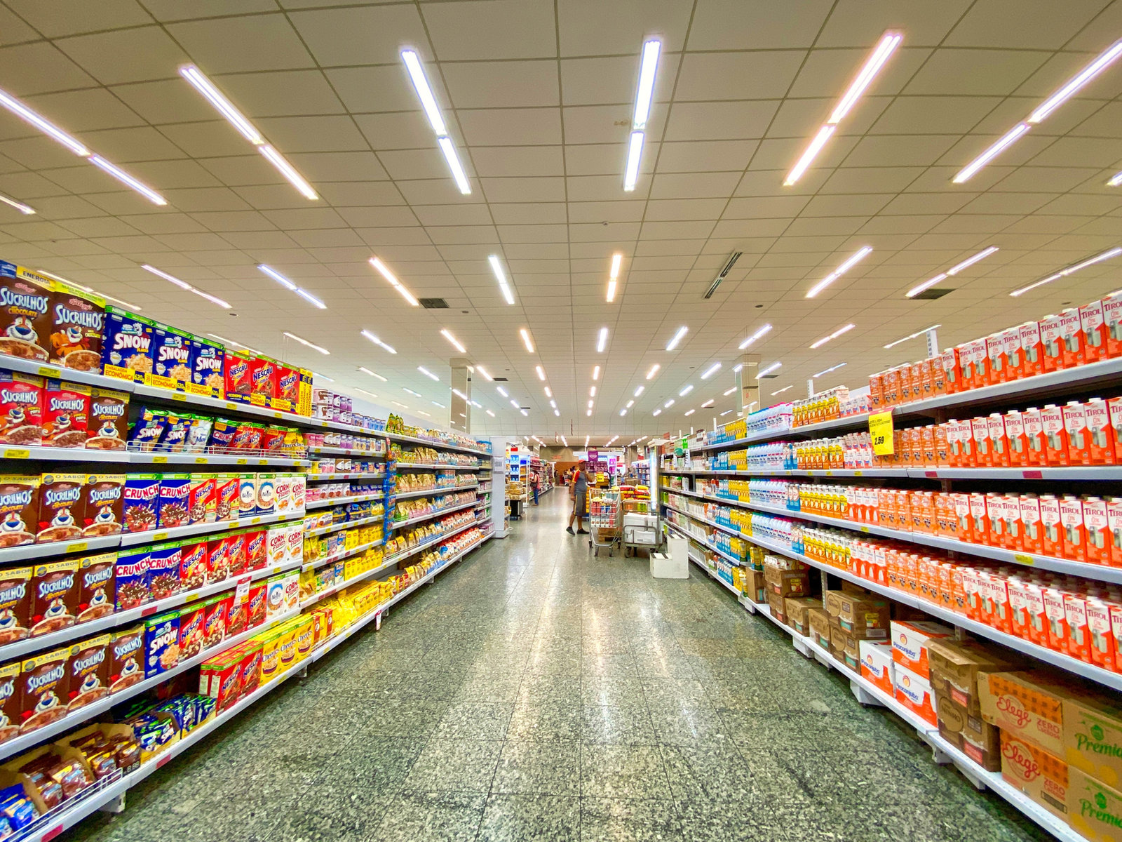 Supermarket aisle stocked with daily essentials